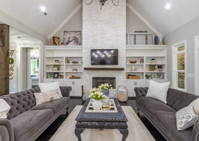 Spacious living room with gray couches and gray coffee table